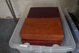 A box of eight cigarette card albums.