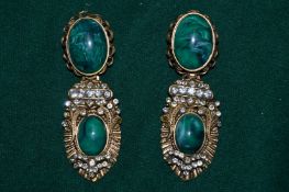 A pair of decorative earrings.
