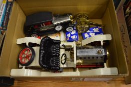 A Mamod steam powered car and another car.