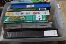 A box of eight collector card albums.