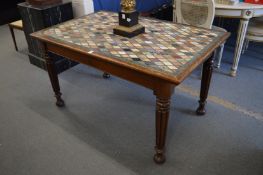 A 19th century specimen marble table, the rectangular top supported on four turned and reeded legs