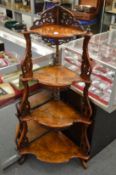 A good Victorian figured walnut four-tier whatnot.