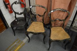 A pair of Victorian papier mache and cane seated occasional chairs and a similar chair.