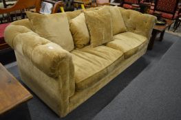A modern velvet upholstered Chesterfield style settee.