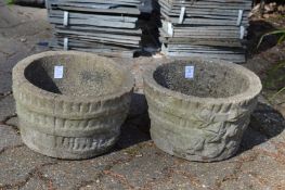 Small pair of reconstituted stone garden pots.