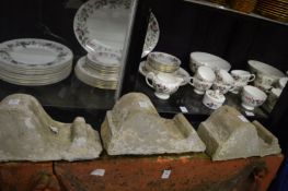 A set of three stone corbels.