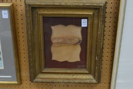 A decorative gilt frame.