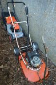 A Flymo petrol hover mower.