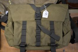 A canvas shoulder bag or holdall.