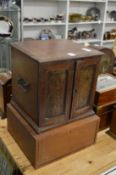 A good 19th century mahogany coin collectors table top two door cabinet and a similar cabinet.