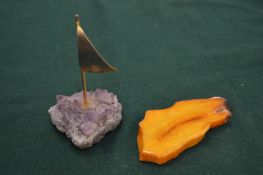 A decorative paperweight and a piece of amber.