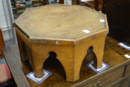 An oak octagonal shaped stand.