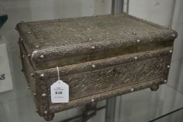 A large Eastern embossed white metal mounted jewellery box.