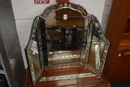 A Venetian style etched glass dressing table mirror.