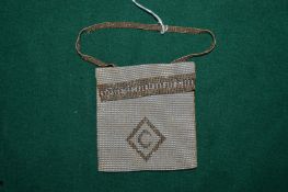 A small seed pearl mounted evening bag or purse.