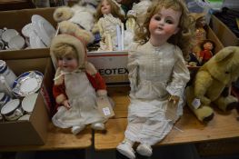 Two porcelain headed dolls.
