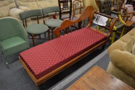 A mahogany framed chaise longue.