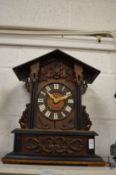 A cuckoo mantel clock.