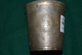 An 18th century white metal beaker, possibly Continental, with engraved inscriptions.