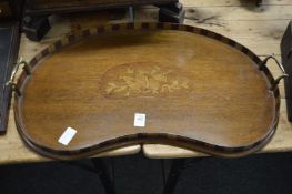 An inlaid mahogany kidney shaped twin handled tray.