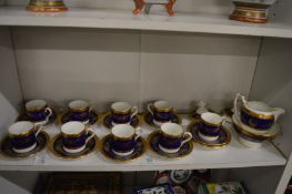 A collection of Coalport Lady Anne coffee cups and saucers together with a matching milk jug and
