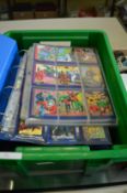 A box of four folders of collectors cards.