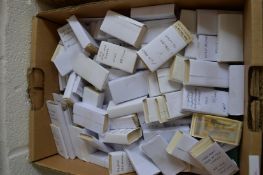 A box of mixed cigarette cards.