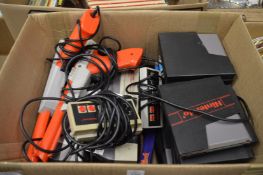 A Nintendo entertainment system, pair of guns, controllers and numerous games.