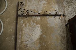 A wrought iron sign bracket.