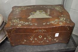 A Continental rosewood and pewter inlaid sewing box.