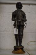 A miniature model of a suit of armour.