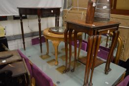 A nest of tables and other items.