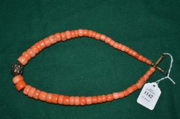 A coral necklace.