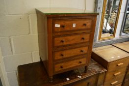 A small chest of drawers.