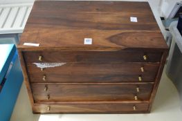 A chest of collector coins and medallions.