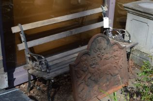 A garden bench with cast irons ends and wooden slats.