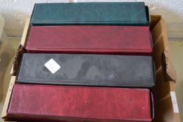 Four albums of cigarette cards.