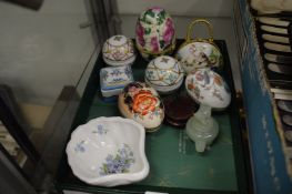 Porcelain trinket boxes and other items.