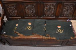 A set of four green pennants with embroidered crown and initials R.Y.