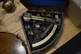 A cased sextant.