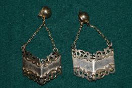 A pair of signed earrings.