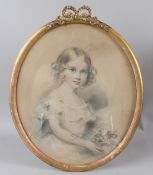 CIRCLE OF THOMAS LAWRENCE Young girl holding a posy coloured chalks oval 40.5 x 34cm (a/f)