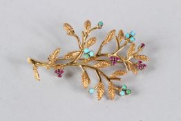 A GOOD YELLOW METAL, RUBY AND TURQUOISE SET BROOCH, modelled as a flowering branch, with box. 5cms
