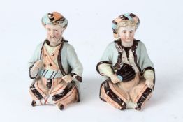 A PAIR OF 19TH CENTURY ANTIQUE GERMAN BISQUE NODDER ORIENTAL MIDDLE EASTERN FIGURES. 12cms high