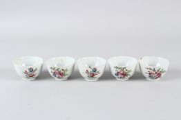 FIVE 19TH CENTURY CONTINENTAL PORCELAIN TEA BOWLS, with floral decoration. 7cms diameter.