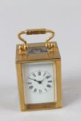 A GOOD MINIATURE BRASS CARRIAGE CLOCK.