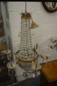 A GOOD PAIR OF ORMOLU AND CUT GLASS SIX BRANCH CHANDELIERS.