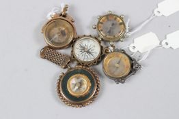 A COLLECTION OF FIVE MINIATURE CHARM COMPASSES.