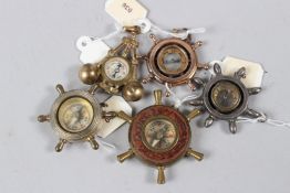 A COLLECTION OF FIVE MINIATURE CHARM COMPASSES.