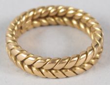 A 15CT GOLD CHEVRON DESIGN WEDDING BAND. 8gms.